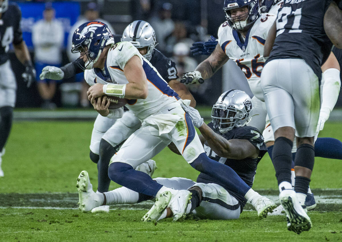 Denver Broncos quarterback Drew Lock (3) is sacked by Raiders defensive tackle Quinton Jefferso ...