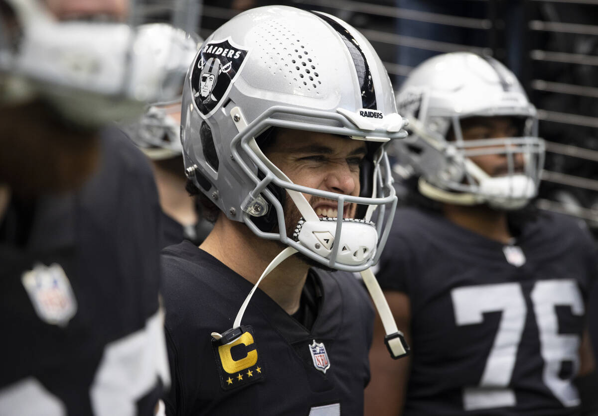 Raiders quarterback Derek Carr (4) waits to take the field before the start of an NFL football ...