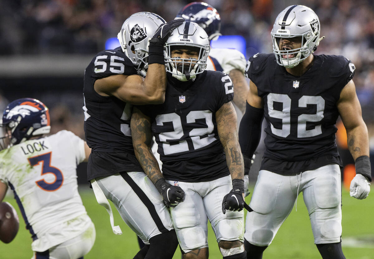 Raiders defensive back Keisean Nixon (22) celebrates a big defensive play with teammates Marque ...