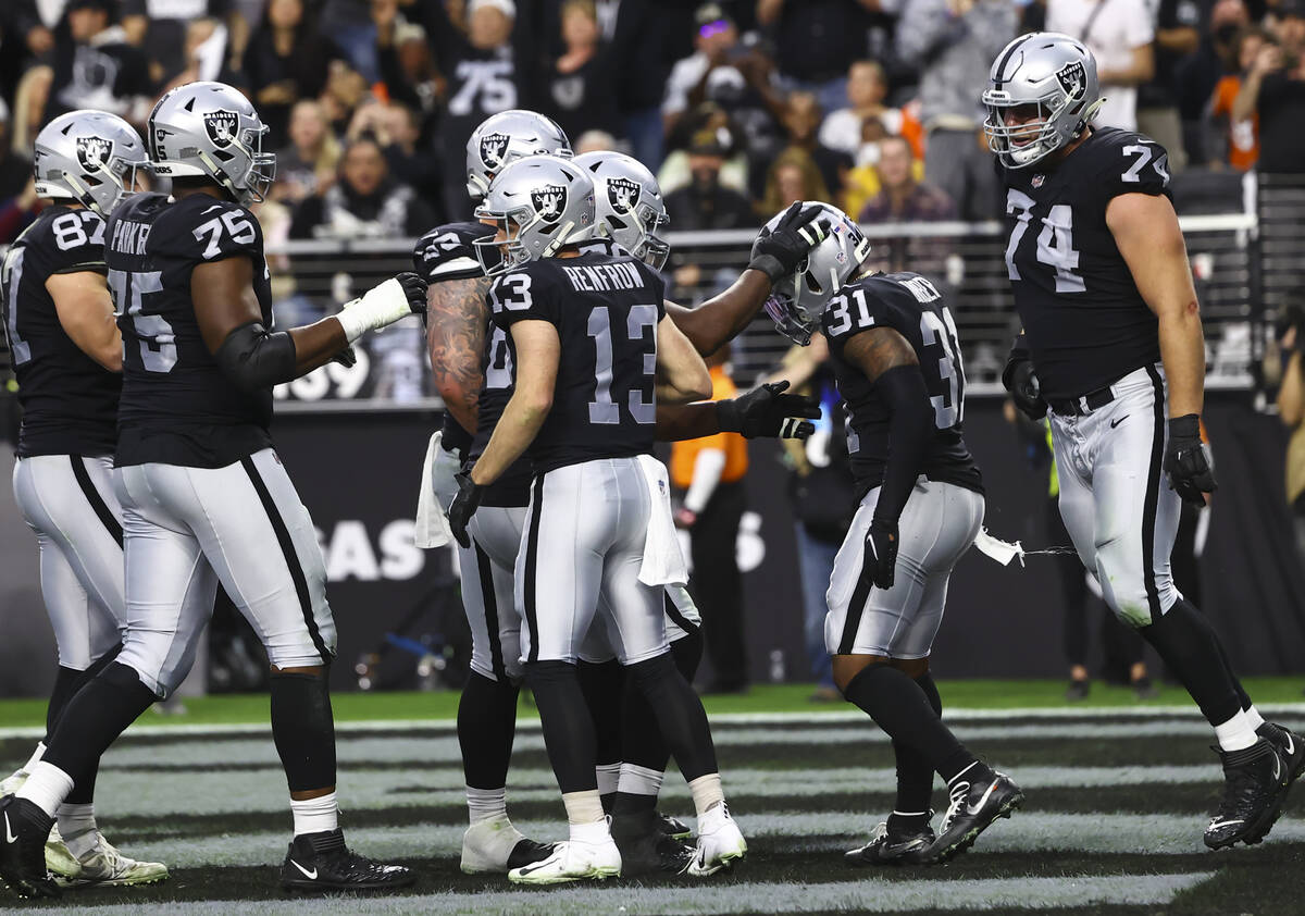 Raiders running back Peyton Barber (31) celebrates his touchdown against the Denver Broncos wit ...