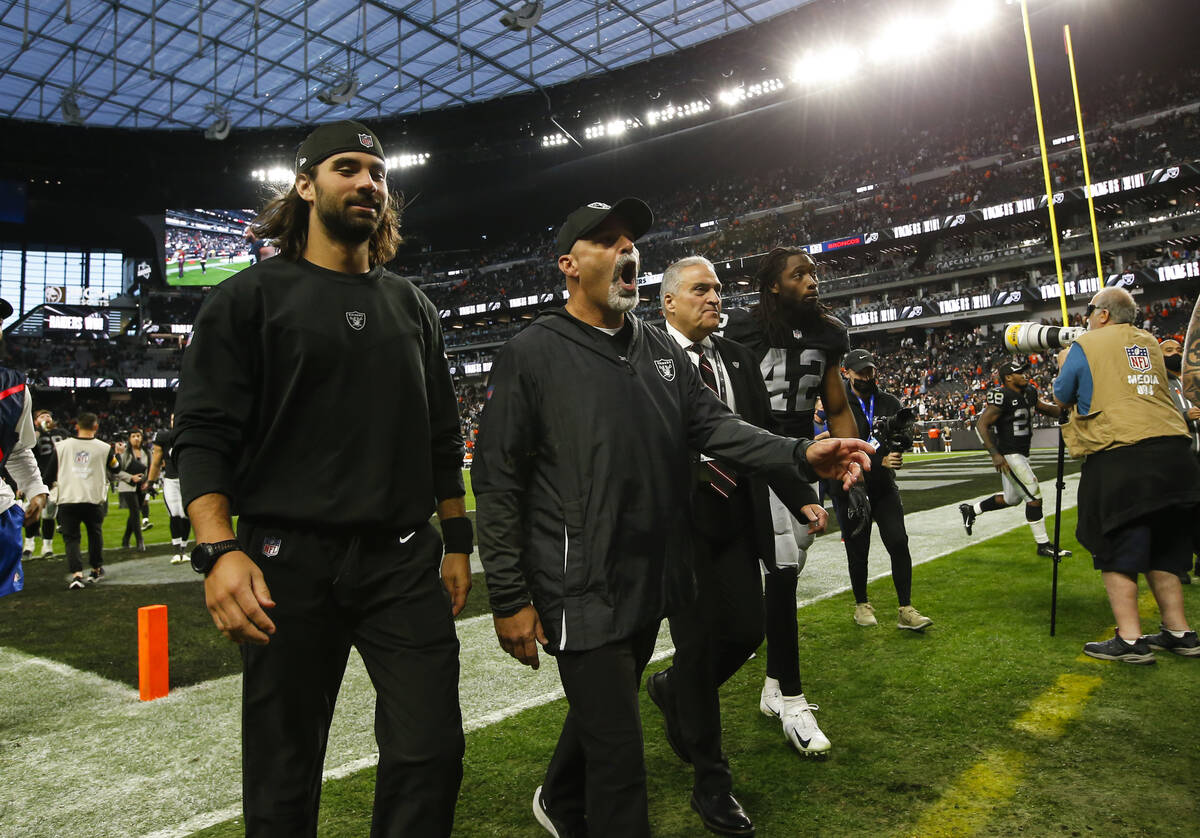 Raiders interim head coach Rich Bisaccia, center, reacts while walking off the field after defe ...