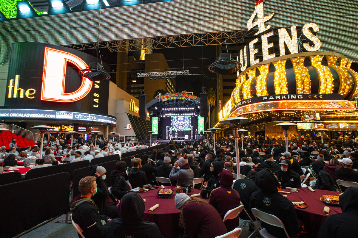 Arizona State players, right, attend a welcome reception along with Wisconsin at the Fremont St ...