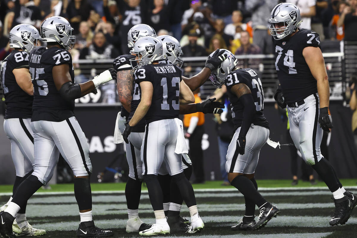 Raiders running back Peyton Barber (31) celebrates his touchdown against the Denver Broncos wit ...