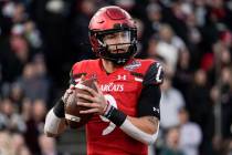 Cincinnati quarterback Desmond Ridder (9) looks to pass from the pocket during the first half o ...