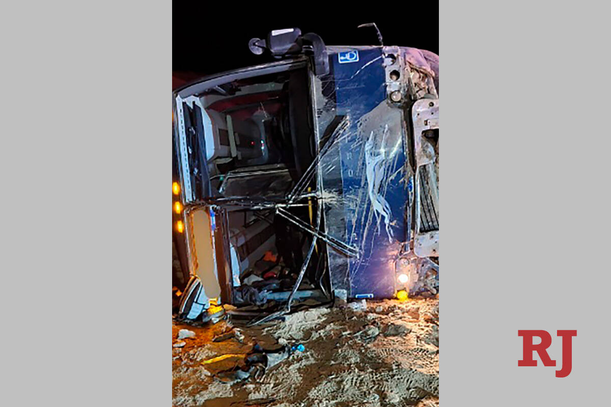 This photo from the Utah Department of Public Safety, shows a Greyhound bus laying on its side ...