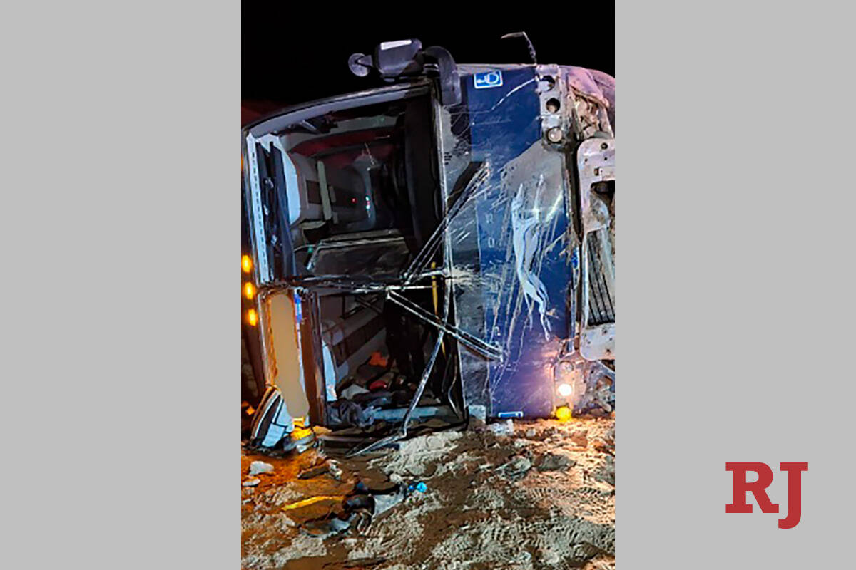 This photo from the Utah Department of Public Safety, shows a Greyhound bus laying on its side ...