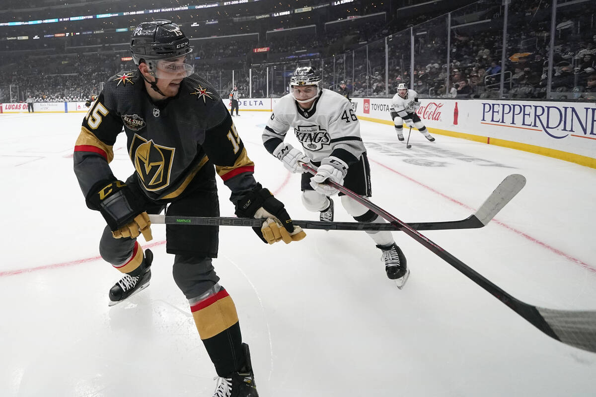 Vegas Golden Knights center Jake Leschyshyn (15) passes the puck under the stick of Los Angeles ...