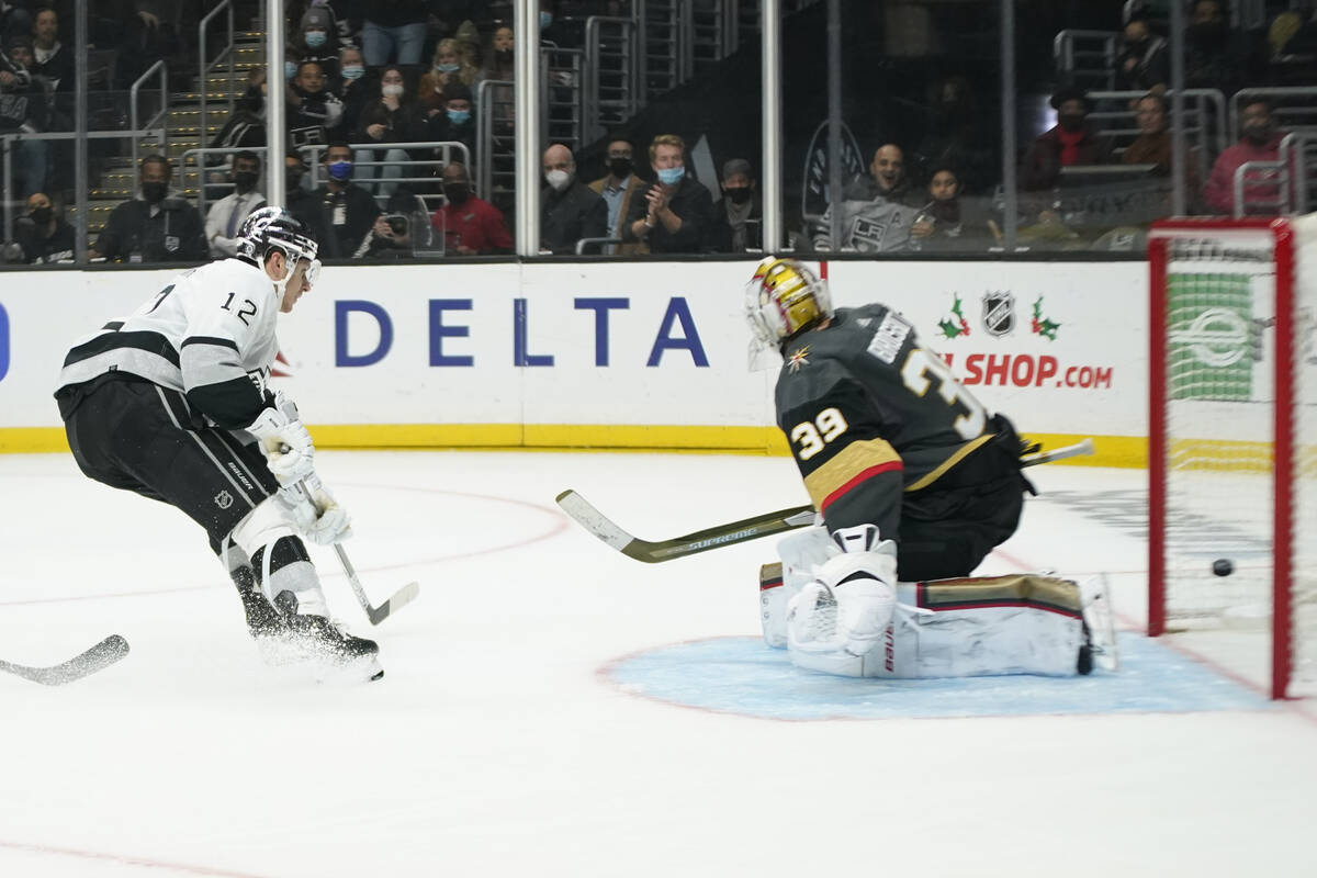 Los Angeles Kings center Trevor Moore (12) scores a goal against Vegas Golden Knights goaltende ...