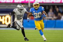 Los Angeles Chargers running back Austin Ekeler (30) breaks off a big run past Raiders cornerba ...