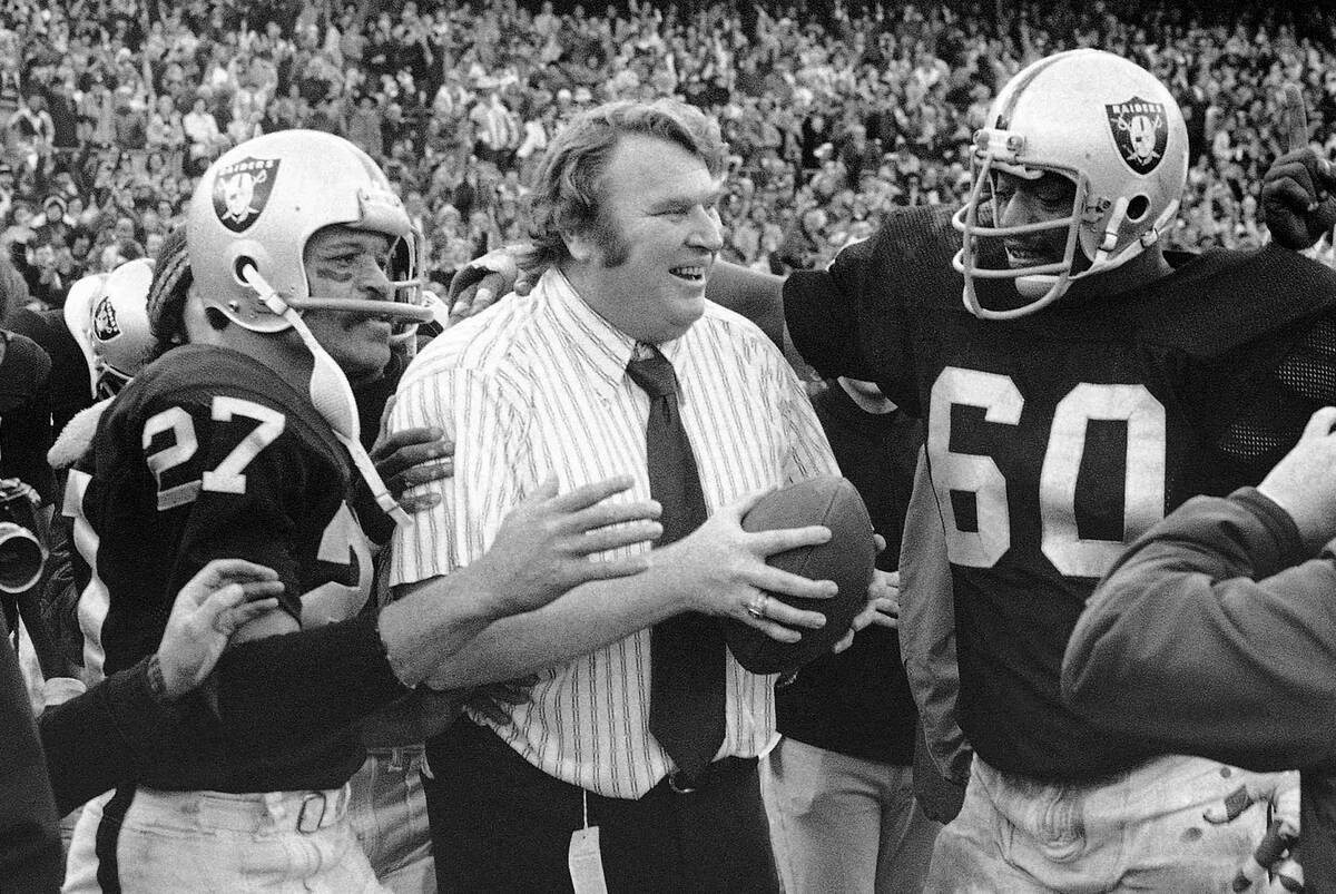In this Dec. 21, 1974, file photo, Oakland Raiders coach John Madden holds the ball which was u ...