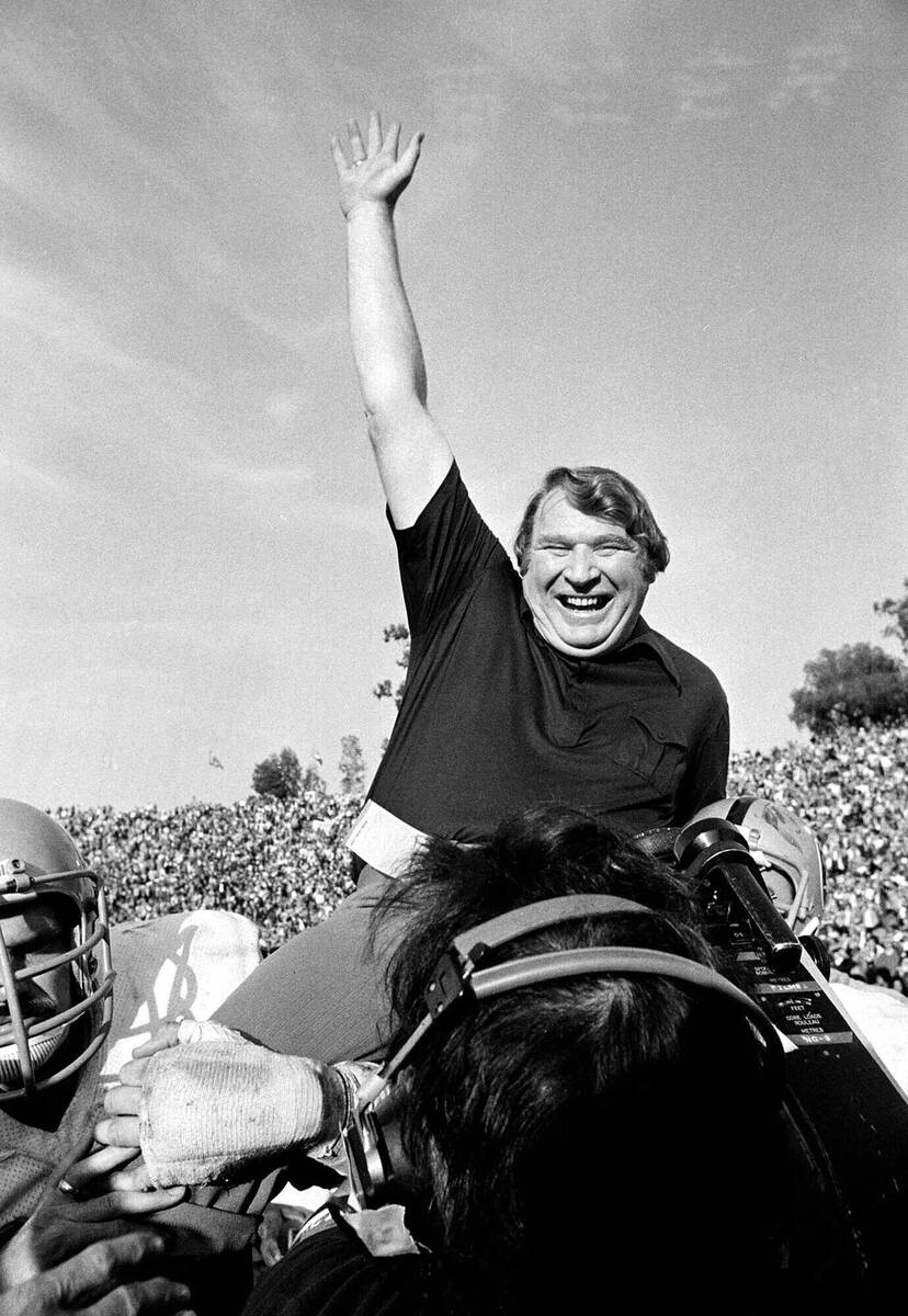 Coach John Madden of the Oakland Raiders is carried from the field by his players after his tea ...