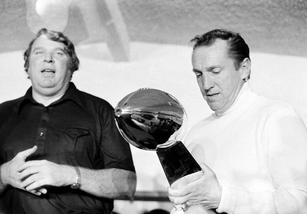 In this Jan. 9, 1977, file photo, Oakland Raiders coach John Madden, left, talks as team owner ...