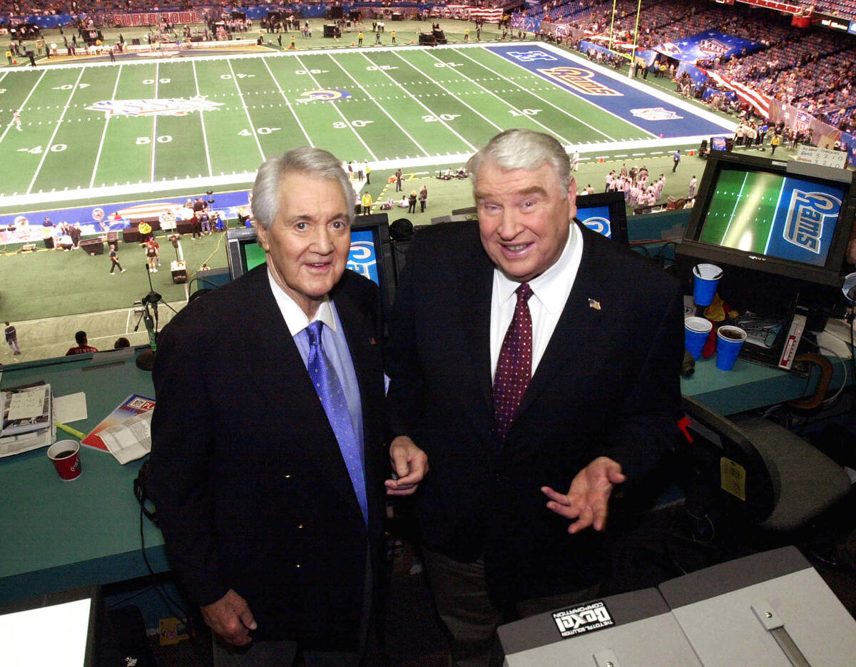 In this Feb. 3, 2002, file photo, Fox broadcasters Pat Summerall, left, and John Madden stand i ...