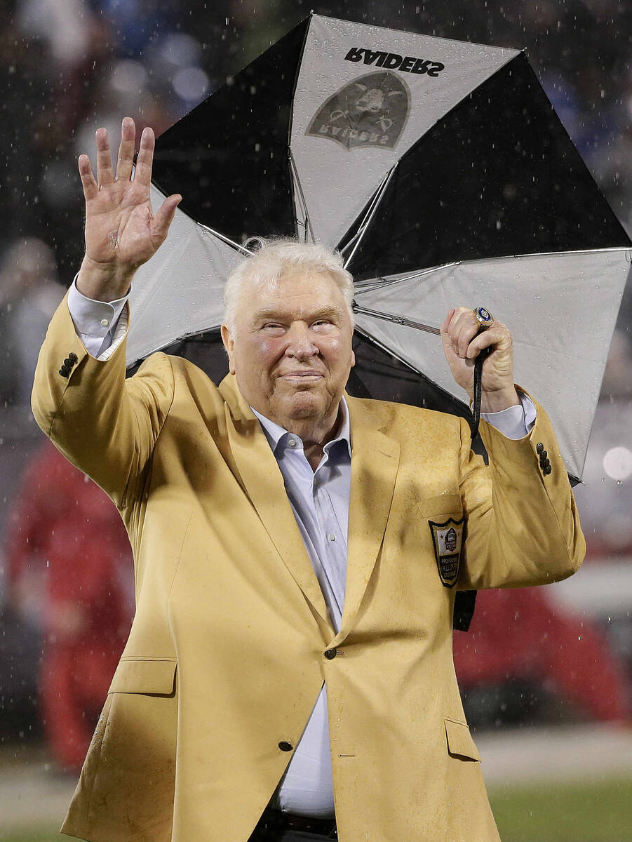 Former Oakland Raiders coach John Madden waves during a ceremony honoring former punter Ray Guy ...