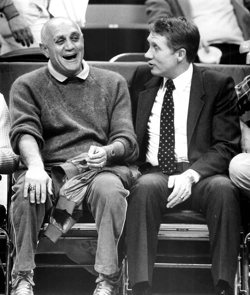 Harry Reid sits courtside with Jerry Tarkanian successful  December 1983. (Review-Journal record  photo)