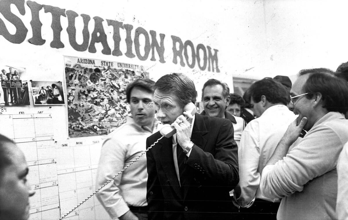Harry Reid takes a telephone  telephone  astatine  his run  caput  quarters successful  1984. (Review-Journal record  photo)