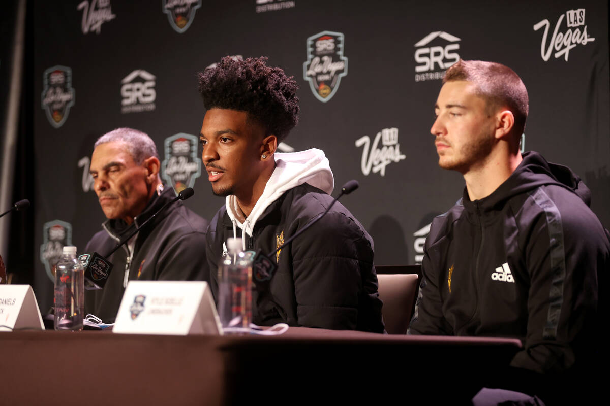 Arizona State coach Herm Edwards, from left, quarterback Jayden Daniels and linebacker Kyle Soe ...