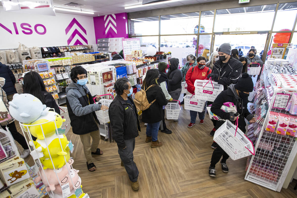 Sanrio characters, including Hello Kitty, are seen on display during the grand opening of Daiso …