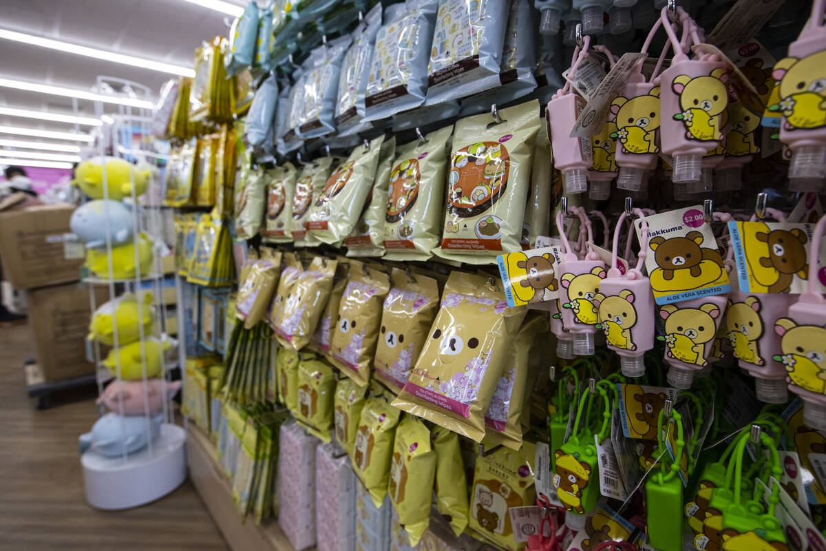 Customers shop during the grand opening of Daiso, a popular Japanese