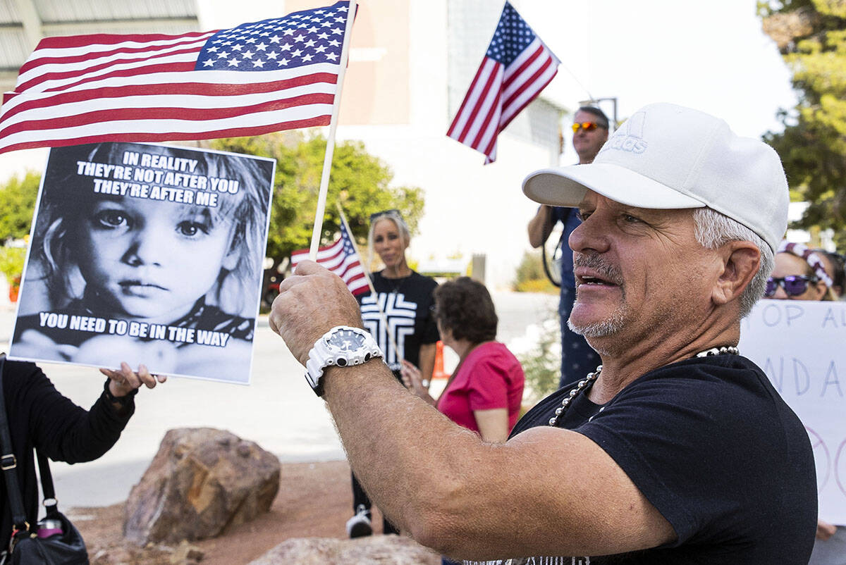 Jay Harrison of Las Vegas protests against the Nevada System of Higher Education's vaccine mand ...