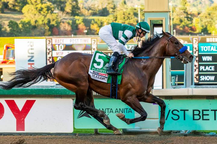 In this image provided by Benoit Photo, Flightline, with Flavien Prat aboard, wins the Grade I, ...