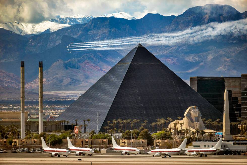 The U.S. Air Force Air Thunderbirds demonstration squadron fly over Las Vegas near the Luxor in ...