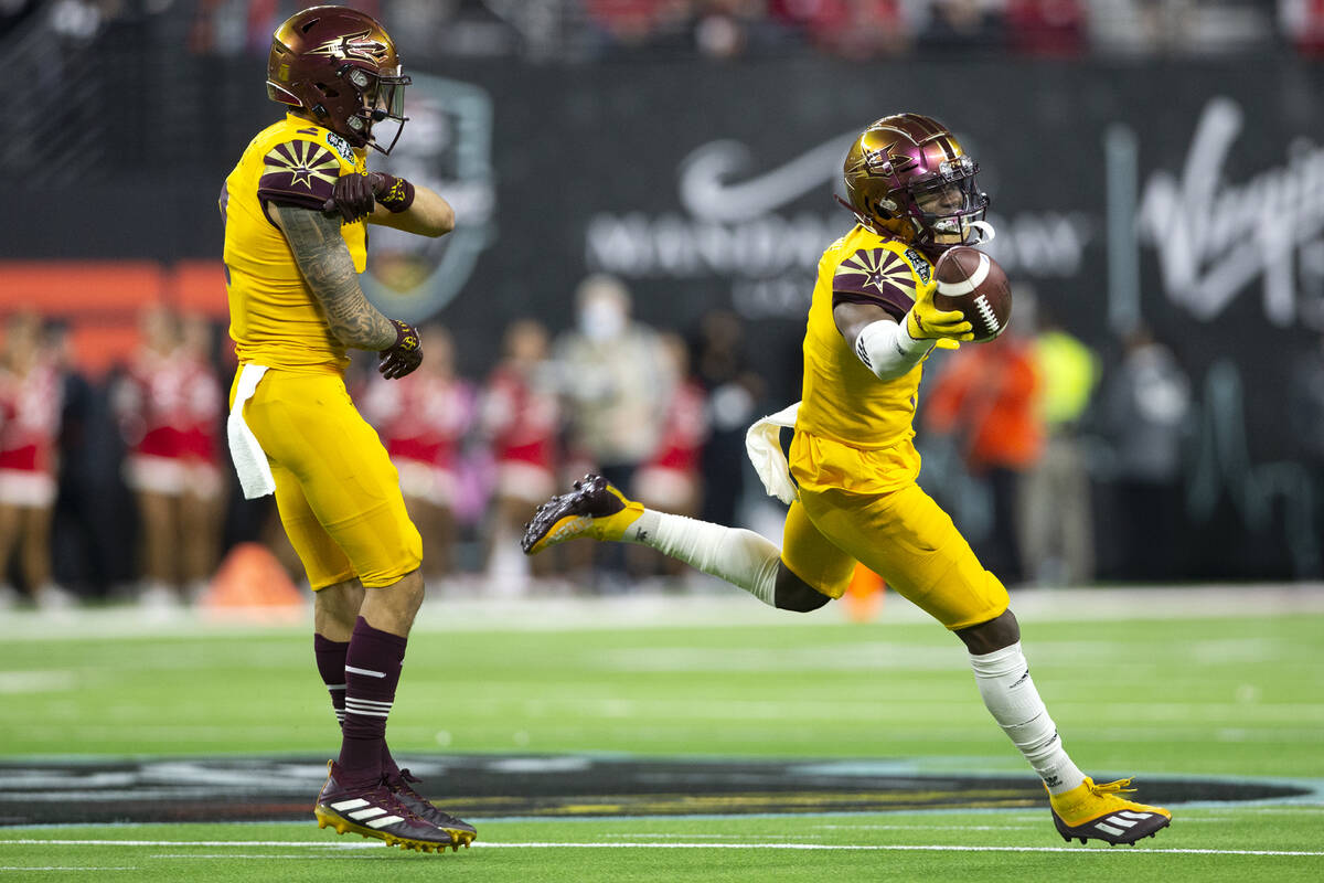 Arizona State Sun Devils defensive back Timarcus Davis (7), right, celebrates after catching an ...