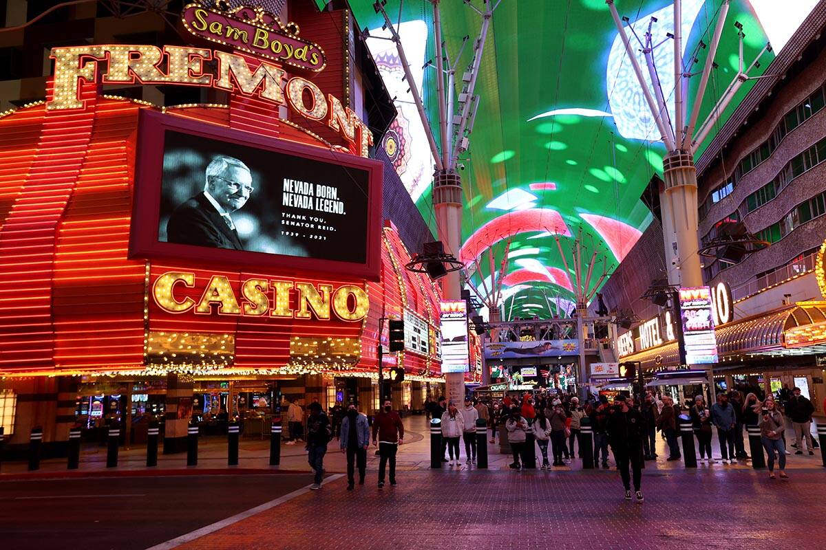 Former U.S. Sen. Harry Reid is shown a video board on the Fremont at the Fremont Street Experie ...