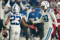 Indianapolis Colts cornerback Kenny Moore II (23) gets a high-five from teammate George Odum (3 ...