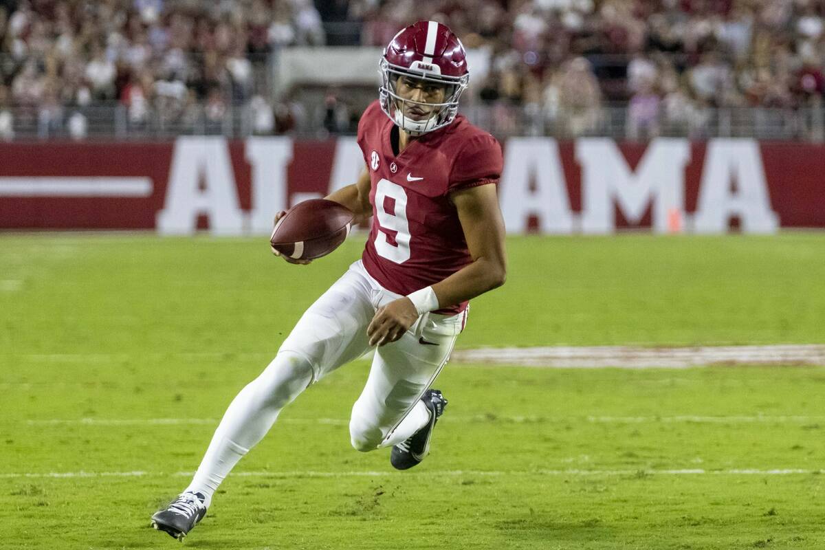 Alabama quarterback Bryce Young runs the ball against Tennessee during the first half of an NCA ...