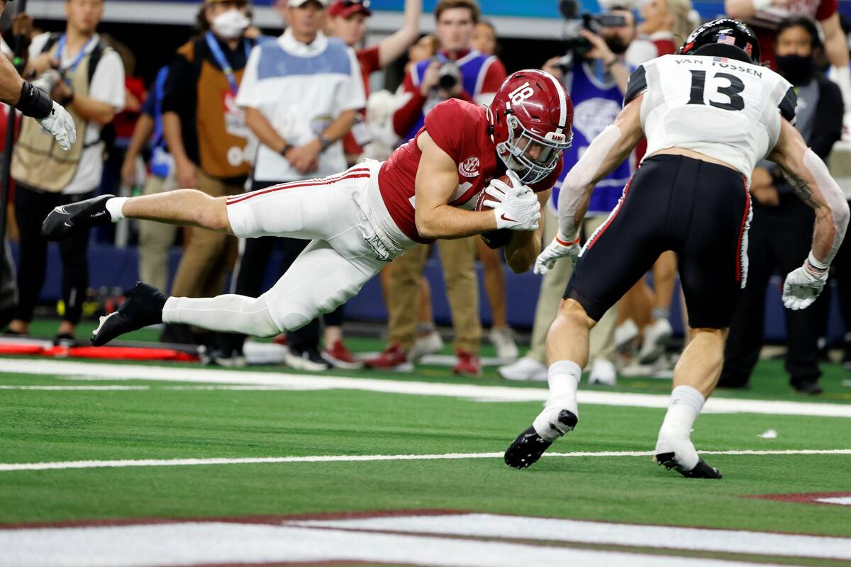 Alabama wide receiver Slade Bolden (18) dives into the end zone for a touchdown after catching ...