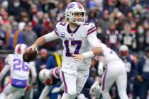 Buffalo Bills quarterback Josh Allen (17) looks to pass during the first half of an NFL footbal ...