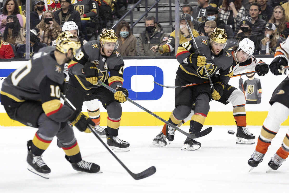 Golden Knights right wing Reilly Smith (19) takes a shot on goal while center Nicolas Roy (10) ...