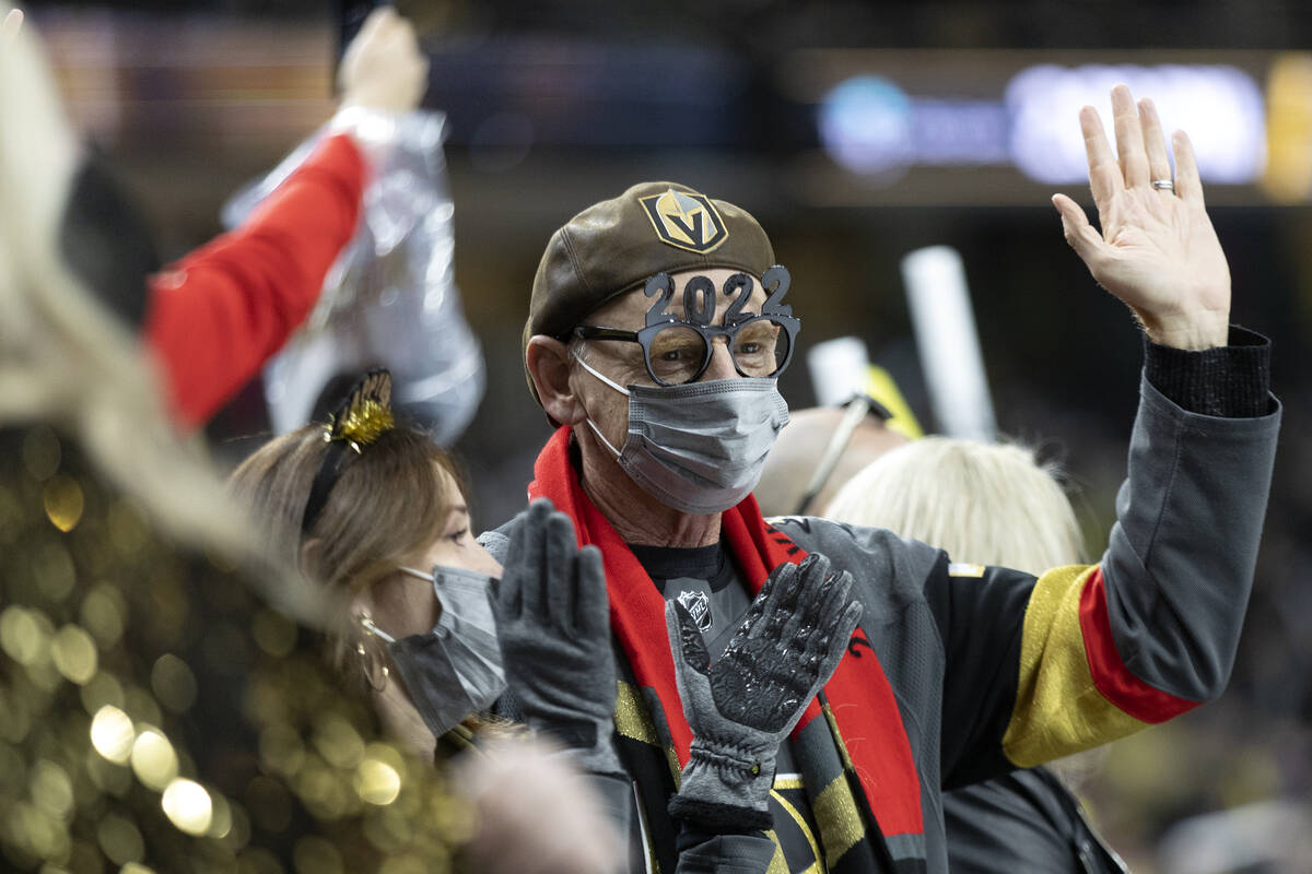 Golden Knights fans wear New Years Eve decor while cheering for their team during the third per ...