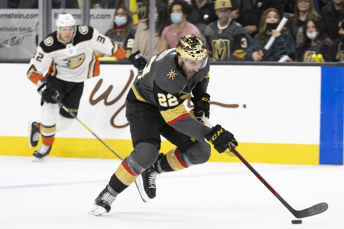 Golden Knights center Michael Amadio (22) breaks away with the puck followed by Ducks defensema ...