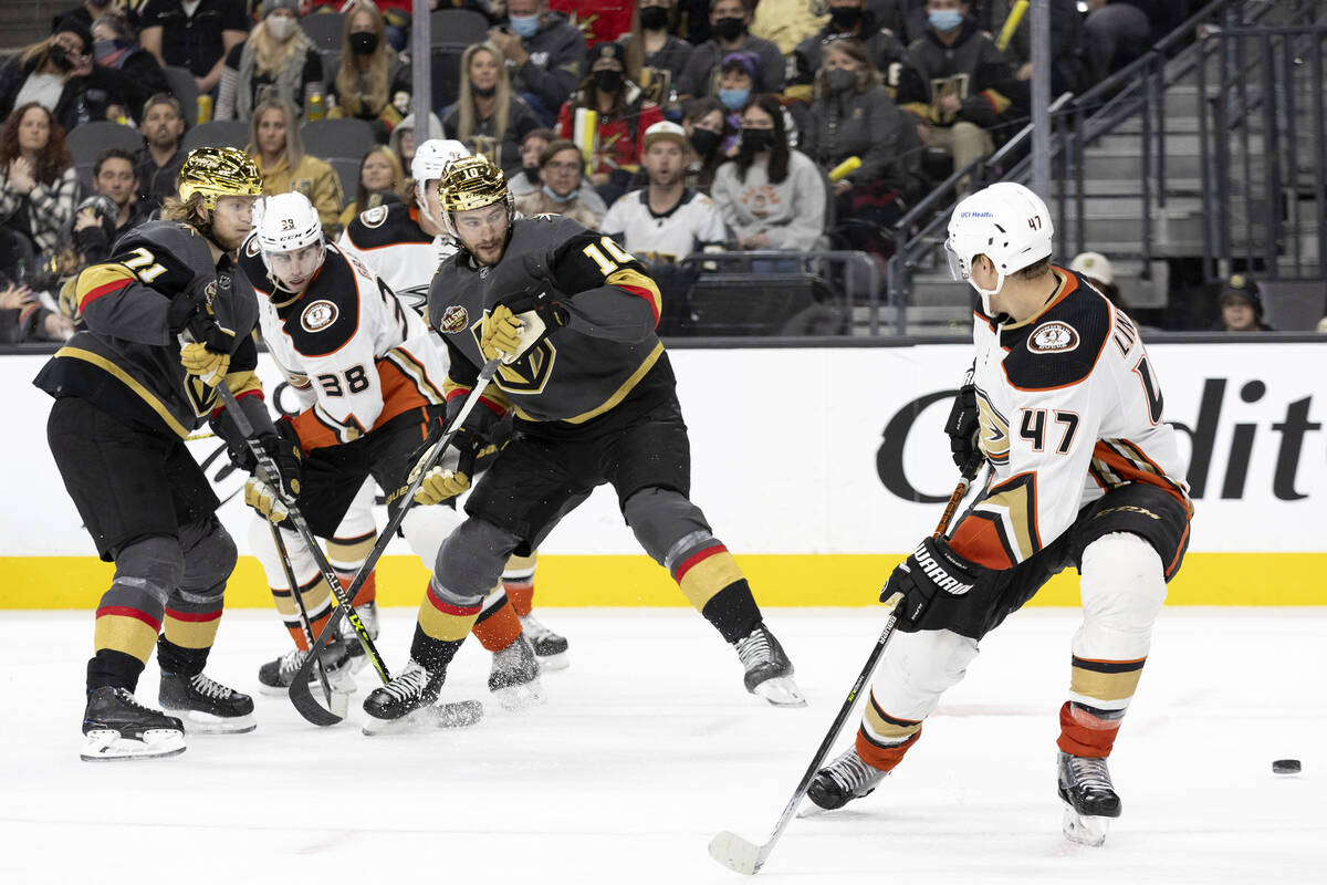 Golden Knights center William Karlsson (71) and center Nicolas Roy (10) look to receive a pass ...