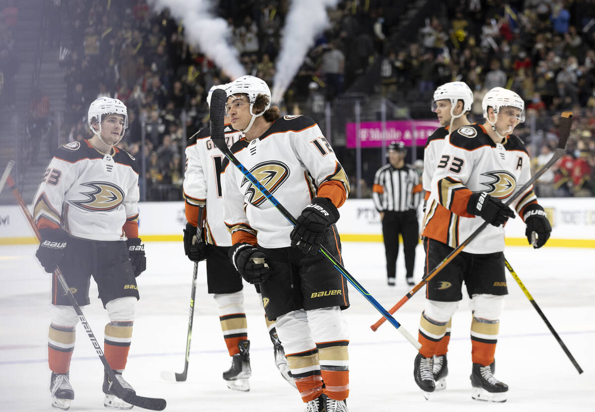 Ducks players including left wing Sonny Milano, center, skate off the ice after losing to the G ...