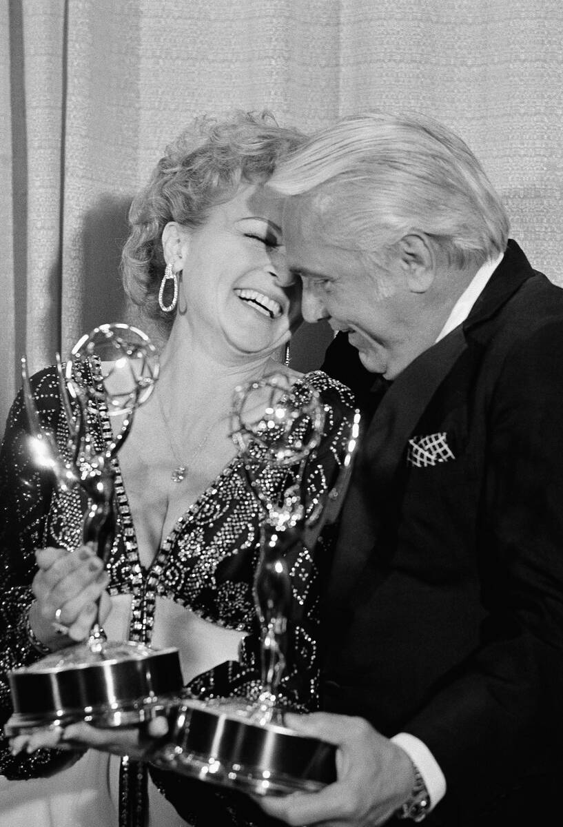 Betty White shares a moment backstage at the 28th annual Emmy Awards with Ted Knight after they ...
