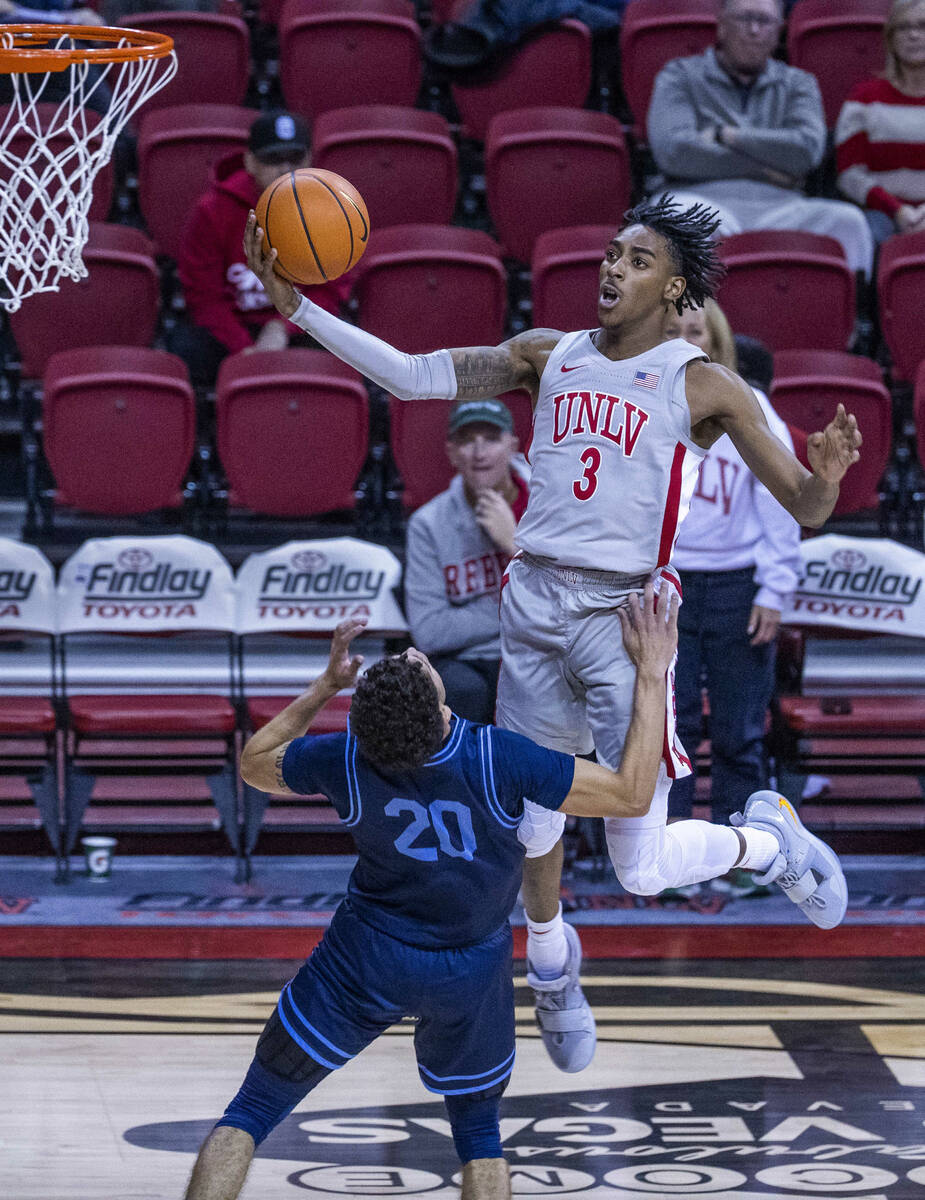 UNLV Rebels forward Donovan Williams (3) elevates for a shot attempt over San Diego Toreros gua ...
