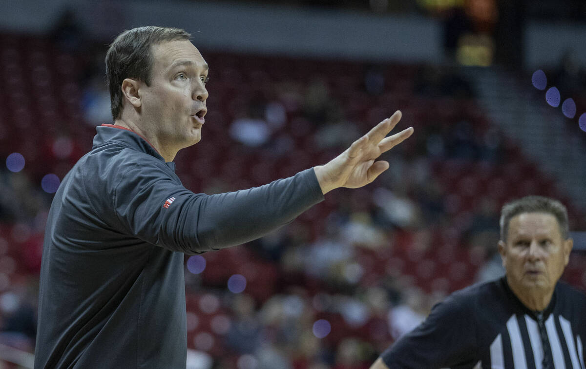 UNLV Rebels head coach Kevin Kruger signals another play to his players versus the San Diego To ...