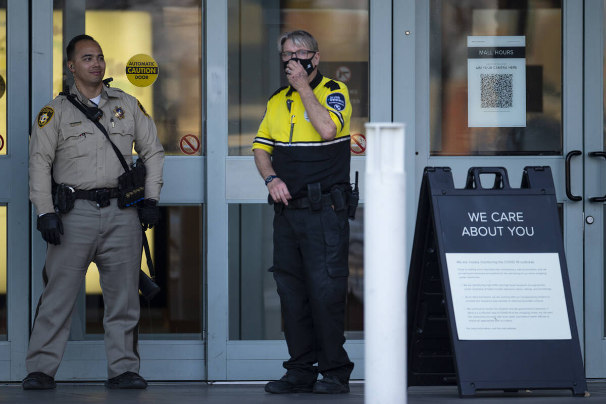 Las Vegas police officers investigate the scene of a shooting at Meadows Mall in Las Vegas, Fri ...