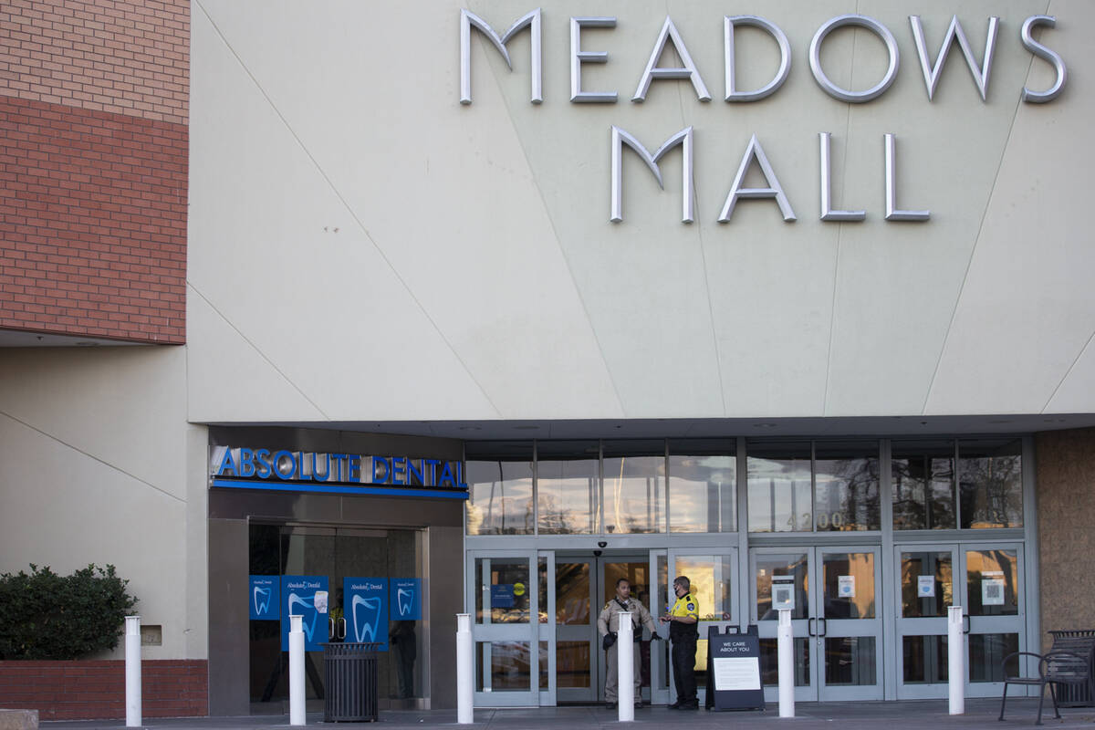 Las Vegas police officers investigate the scene of a shooting at Meadows Mall in Las Vegas, Fri ...