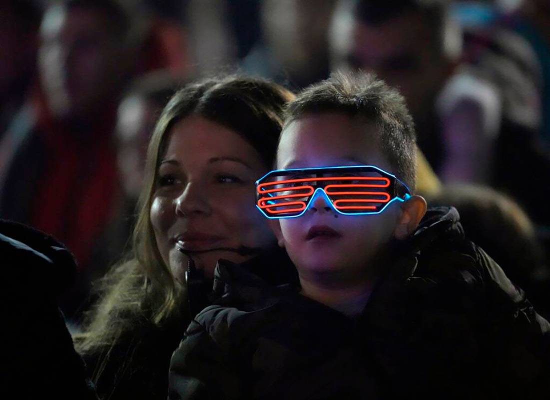People celebrate during a New Year's Eve, in Belgrade, Serbia, Friday, Dec. 31, 2021. Boisterou ...