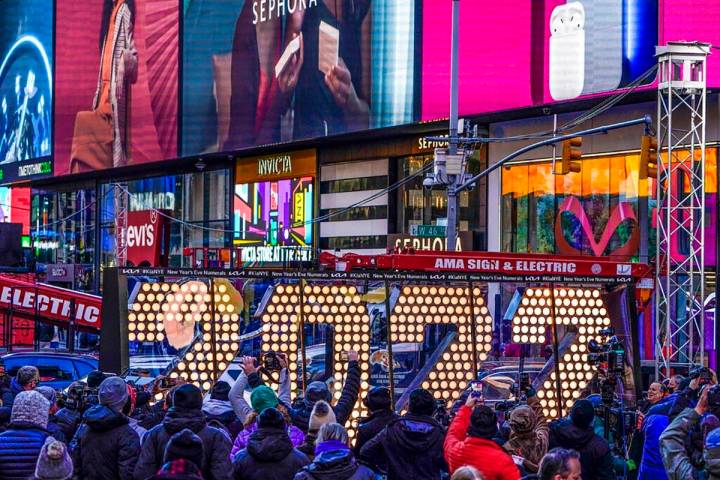 FILE - The 2022 sign that will be lit on top of a building on New Year's Eve is displayed in Ti ...