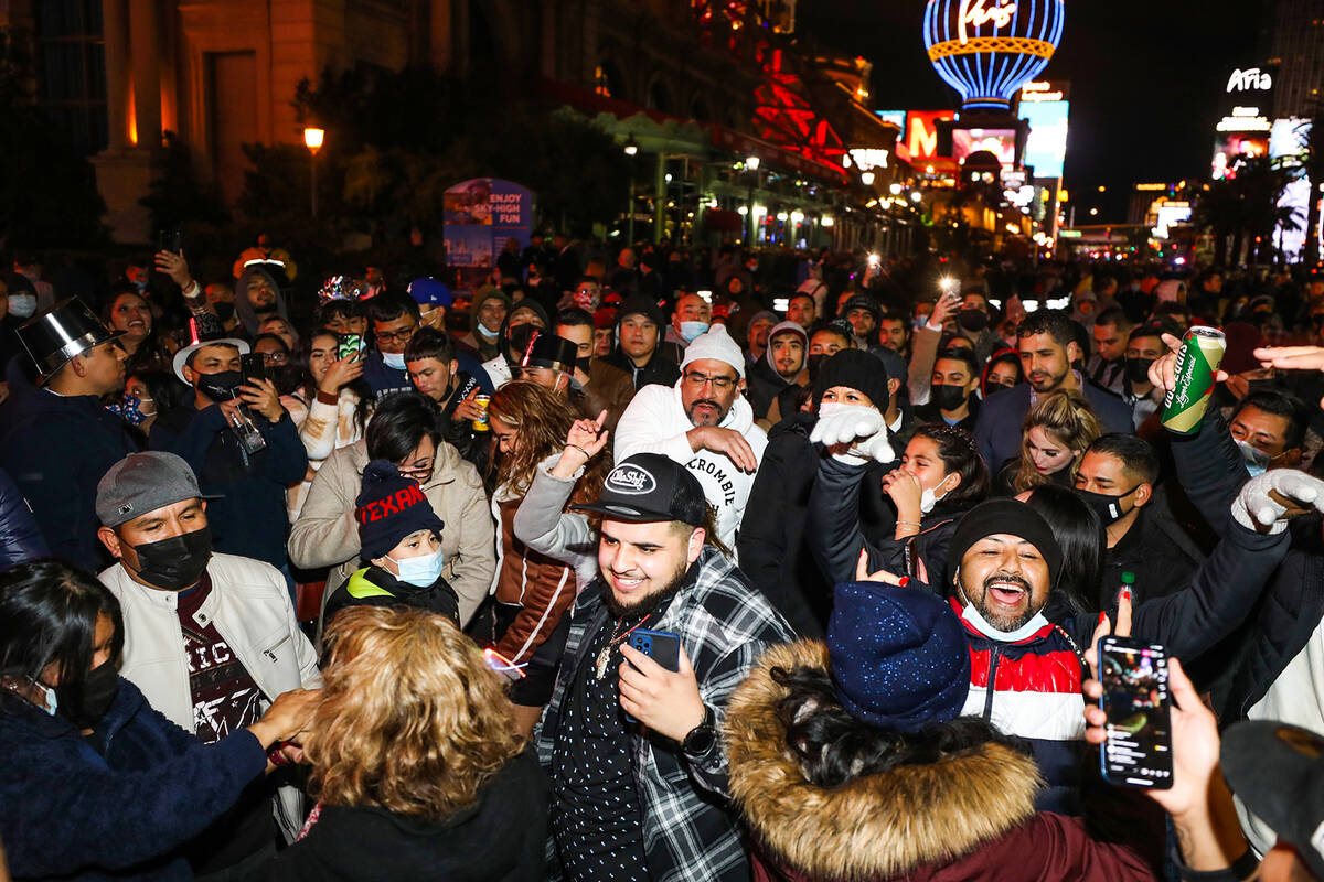 Revelers dance on the Strip in Las Vegas, Friday, Dec. 31, 2021. Rachel Aston/Las Vegas Review- ...