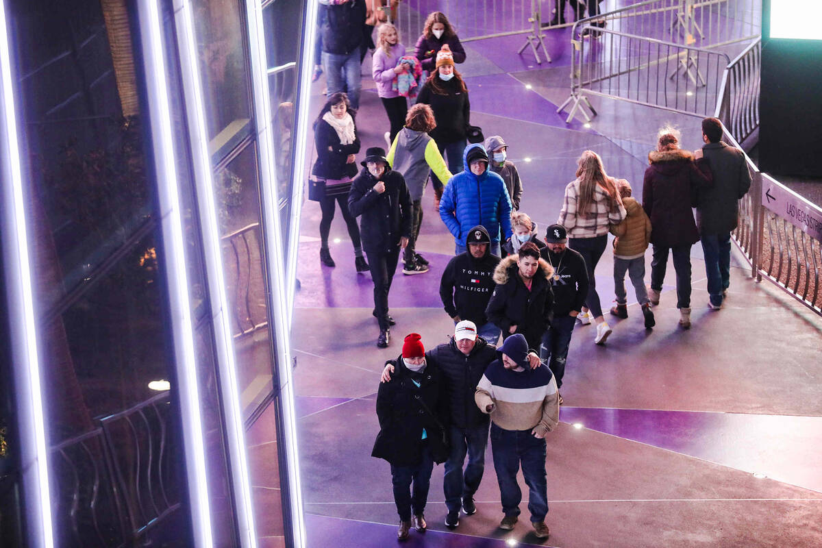 Crowds walk the Strip on Friday, Dec. 31, 2021 in Las Vegas. Rachel Aston/Las Vegas Review-Journal