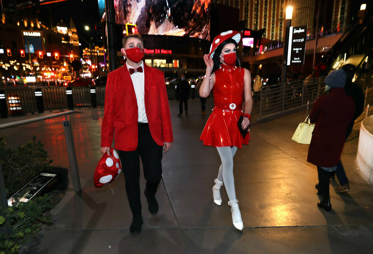 Daniel Lane, left, and Luna Muse walk along the Strip while headed over to the Katy Perry conce ...