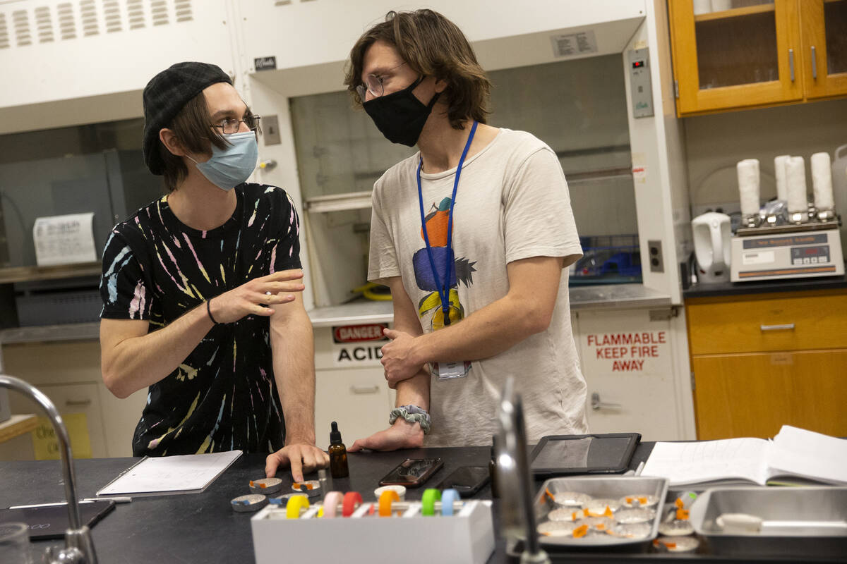 Nevada State College students Adam Hackbarth, left, and Kendrick Seeber discuss the results of ...