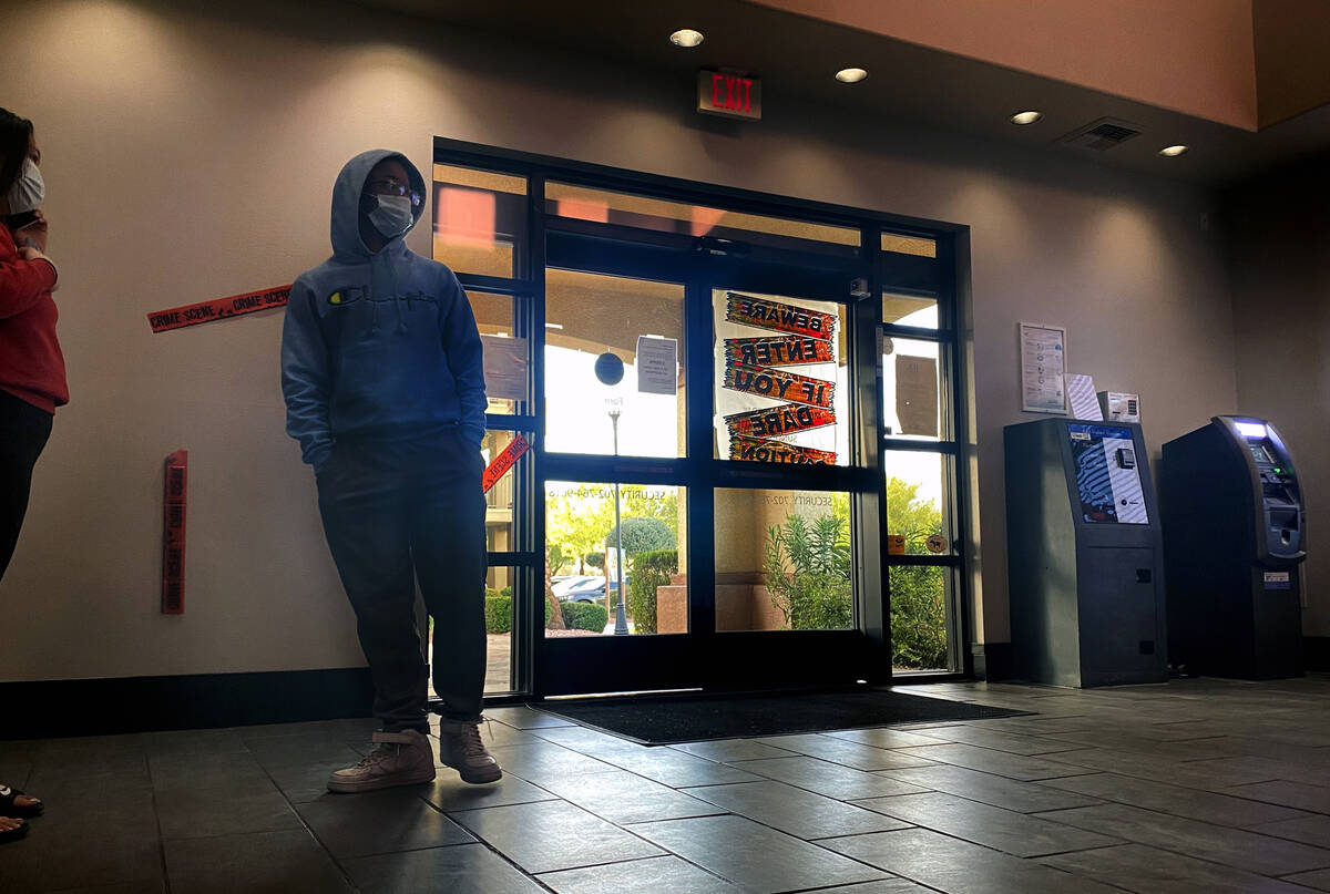 A family waits to rent a room at the Siena Suites office in October 2021. Lines form early in t ...