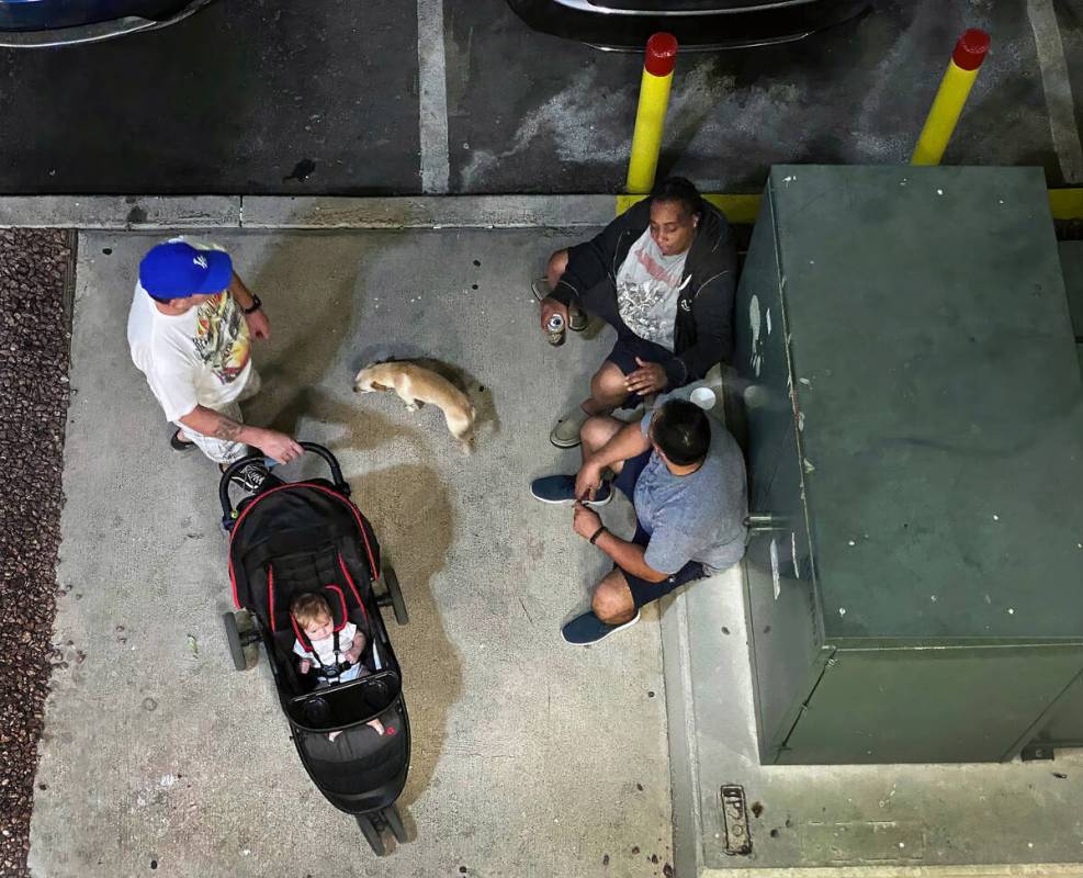 Residents socialize late in the day at the Siena Suites where Metro service calls are high on T ...